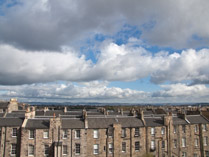 Northeast view from the Royal Scots club of Edinburgh rooftops and the North Sea beyond