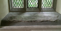 The Braided Cross stone of the early 10th century is set into a window sill in the south transept of Trewern Chapel of the Norman Church of St Brynach, Pembrokeshire, Wales.