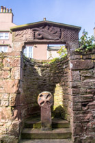 Romanesque lintel Ca 1120 showing St Michael fighting a dragon above a 9th C Celtic style cross