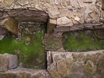 Midhowe Cairn: Neolithic chambered cairn located on the south shore of the island of Rousay, Orkney, Scotland .  A stalled burial chamber, thought to date from about 3500 BCE.