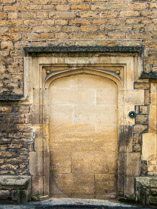 Blocked doorway with a useless doorbell at 17thC Sexey's Hospital almshouses in Bruton, Somerset, England .