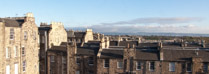 Northeast view from the Royal Scots club of Edinburgh rooftops and the North Sea beyond