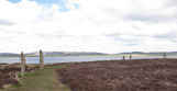 Ring o' Brodgar (generally believed to have been built between 2500 BC and 2000 BC) stands on an eastward-sloping plateau on the Ness o' Brodgar - a thin strip of land separating the Harray and Stenness lochs in the  West Mainland parish of Stenness.  It is believed to be the last of the great Neolithic monuments built on the Ness.
