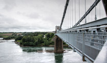 Menai Suspension Bridge, designed by Thomas Telford & completed in 1826, between the island of Anglesey and the mainland of Wales