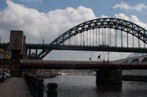 The Tyne Bridge 1928 spans the River Tyne between Newcastle upon Tyne and Gateshead.  It was designed by the engineering firm Mott, Hay and Anderson