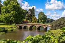 The Palladian Bridge at the eastern end of the lake at Stourhead Gardens in  Stourton, Wiltshire, England.