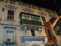 Façade with festival banner, Valleta, Malta