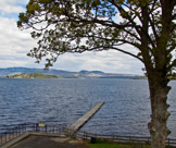The private jetty of The Cruin Restaurant in Arden, on Loch Lomond with a views up the loch to Ben Lomond